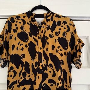 Corey Lynn Calter black and gold animal print midi dress with pockets